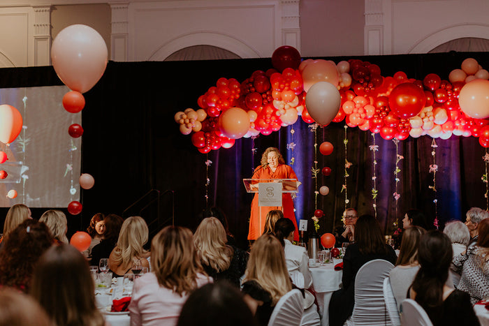 pink balloon garland stage décor with floating centre pieces