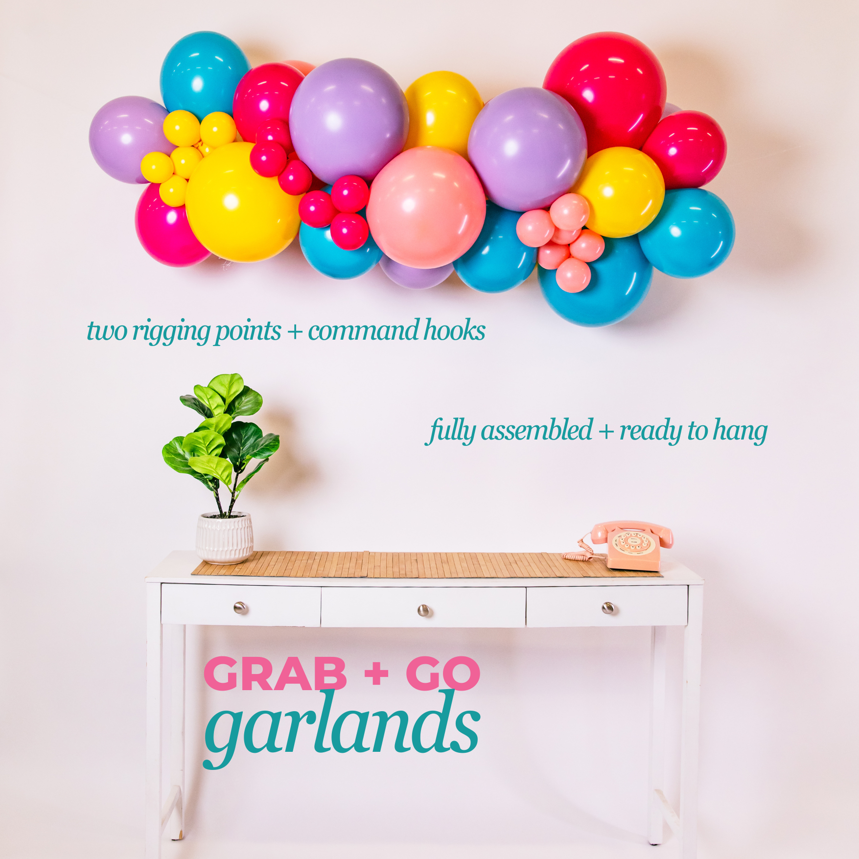 Colorful balloon garland above a white desk with text indicating assembly and availability.